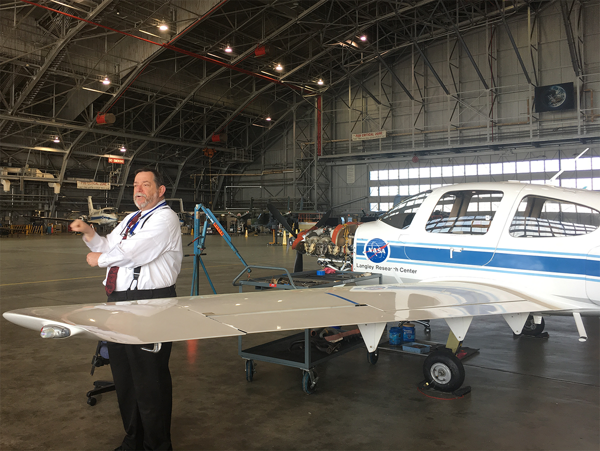 A NASA Langley Research Center education specialist explains a research aircraft
