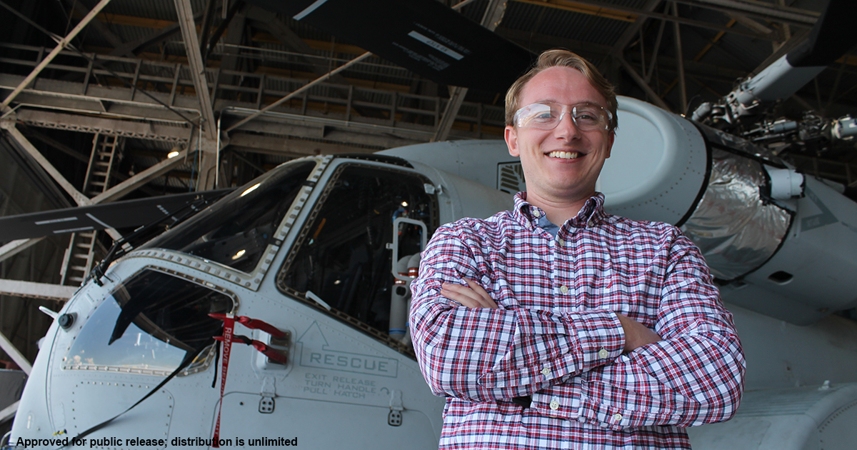 Raven Lauer in front of the Sikorsky CH53K King Stallion helicopter