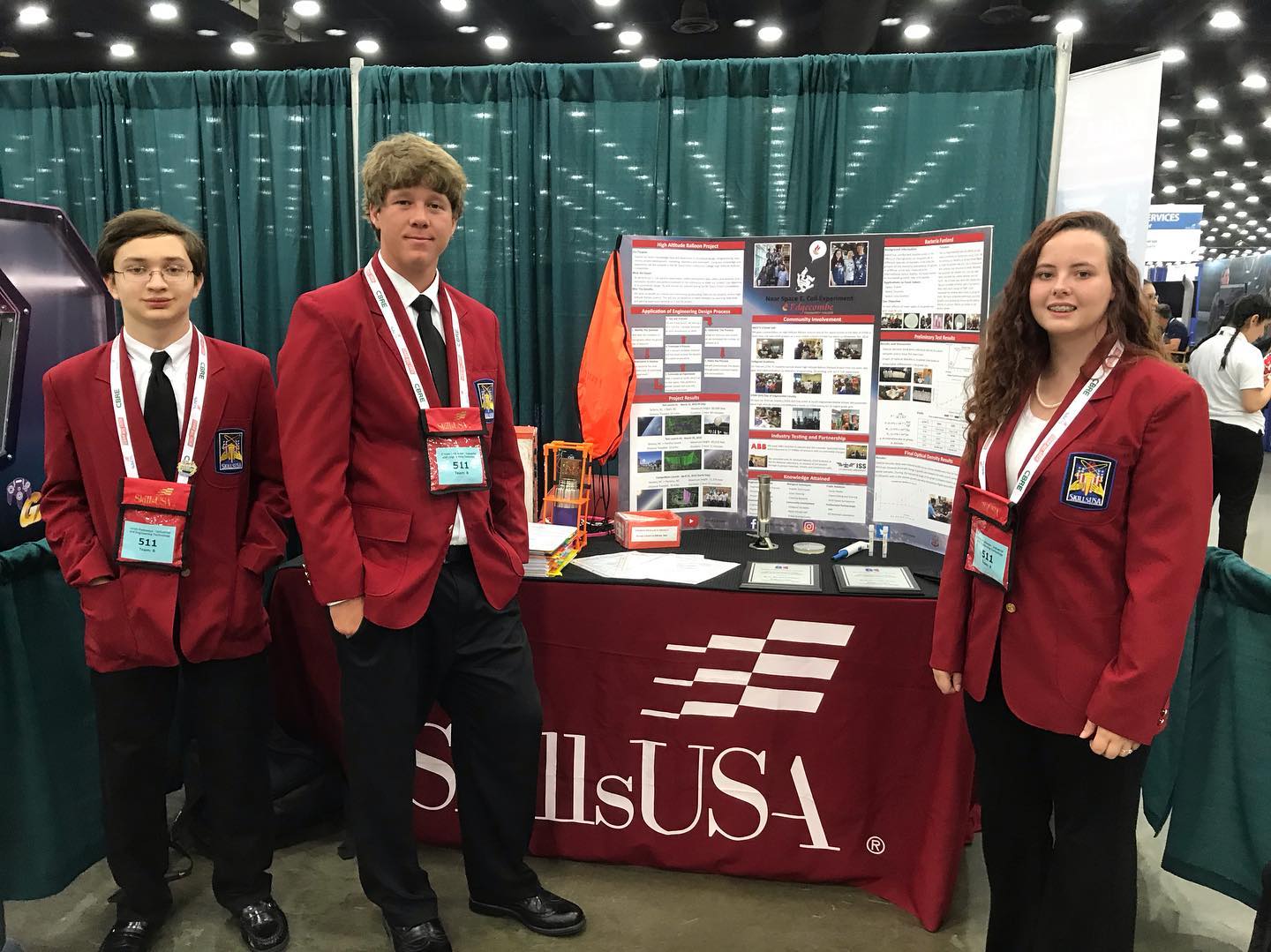 Edgecombe COmmunity College students pose with their champion medals at their SkillsUSA booth.