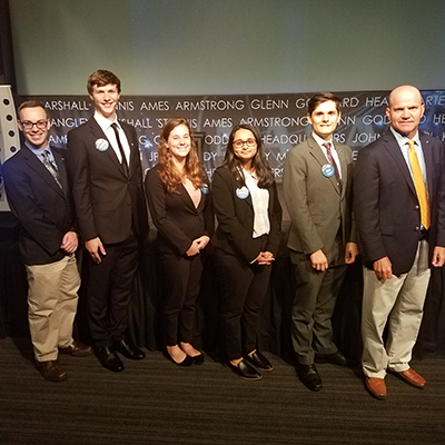 Theurer poses with his NASA DEVELOP internship team and science advisor after presenting their work at the Annual Earth Science Application Showcase (AESAS) in 2018.