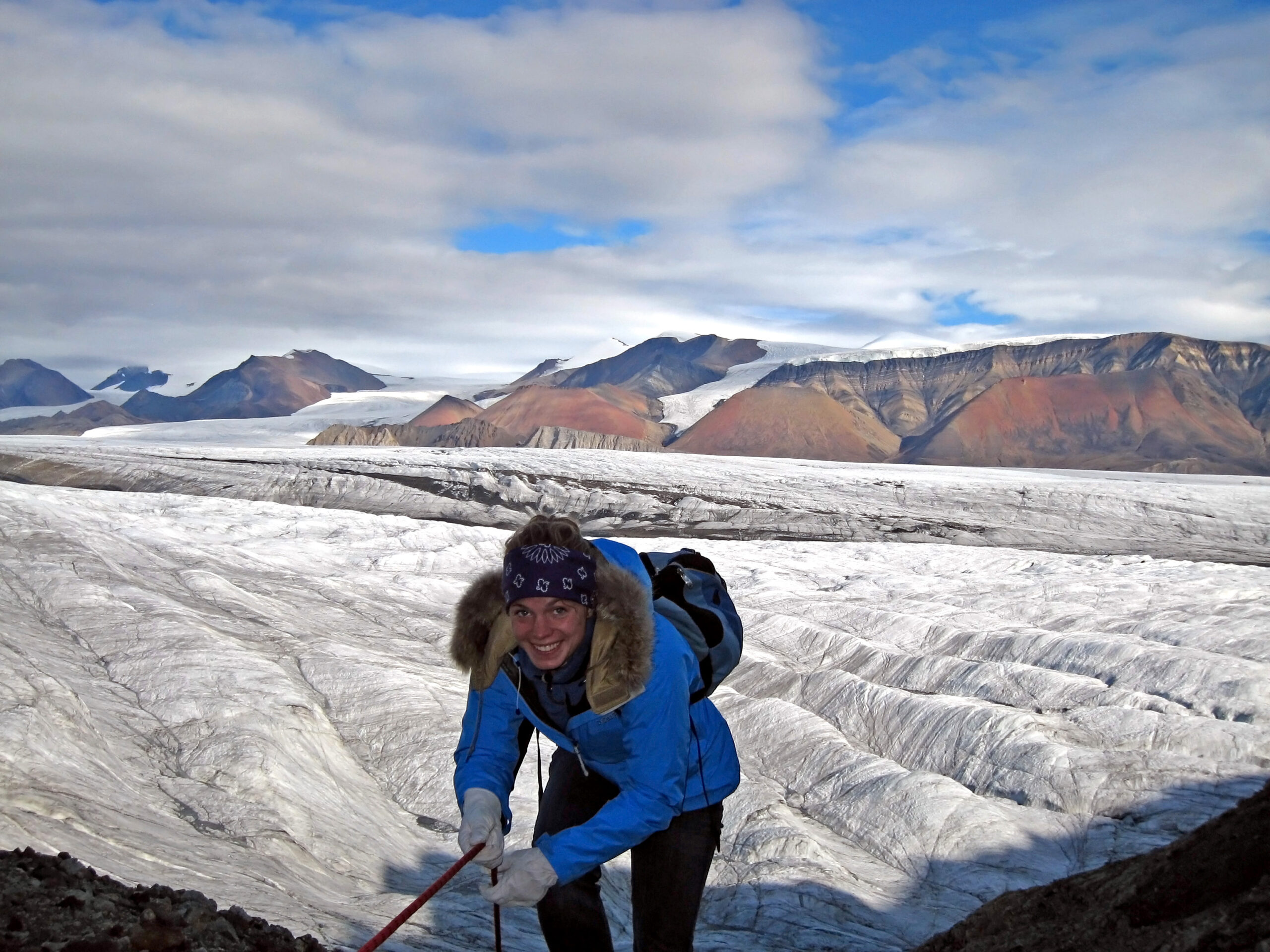 Zena Cardman smiles near a glacier. 