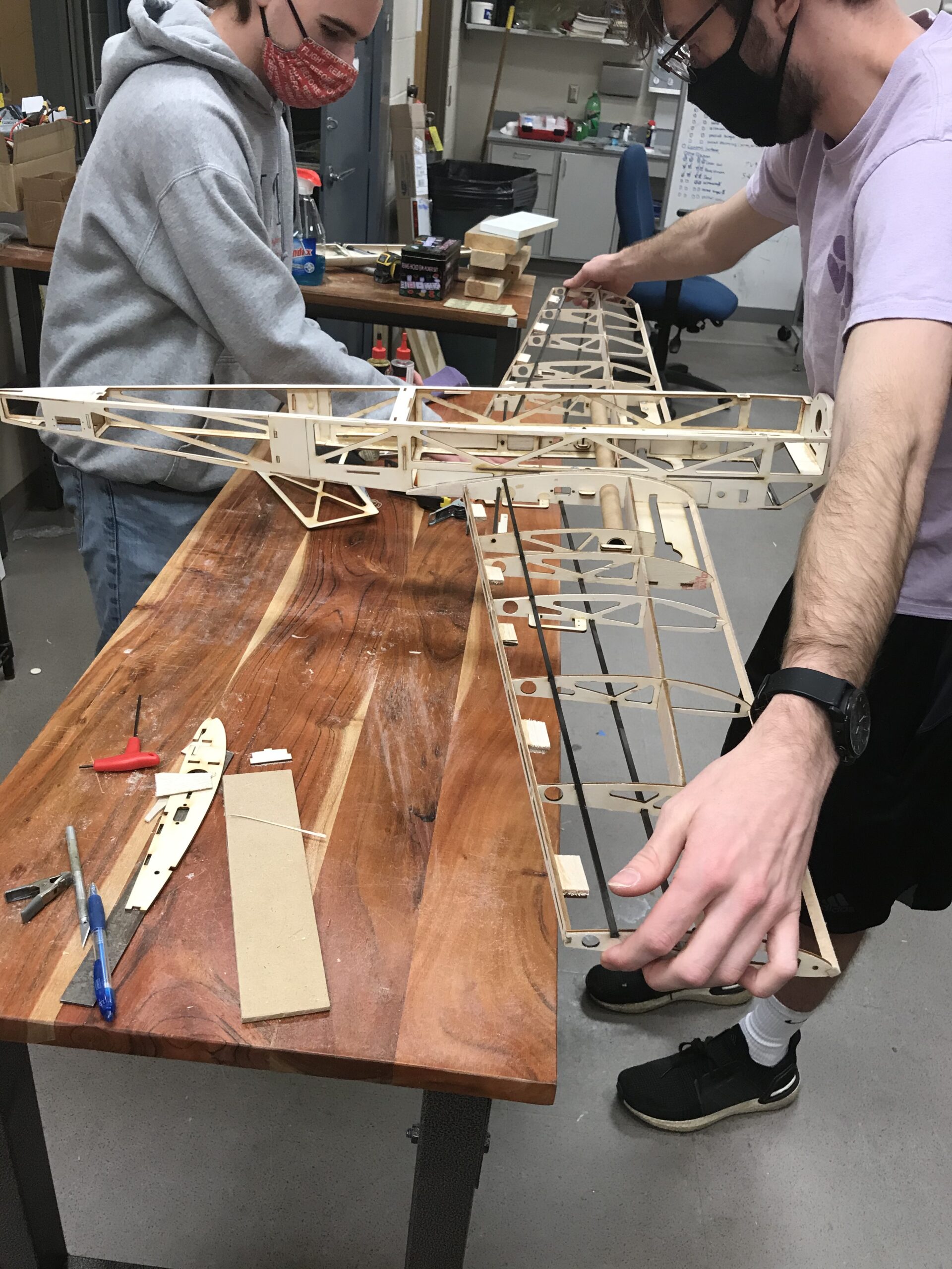 NC State AIAA team members construct the frame of their remote-controlled flyer, Airwolf, built for the 2021 AIAA Design, Build, Fly competition.