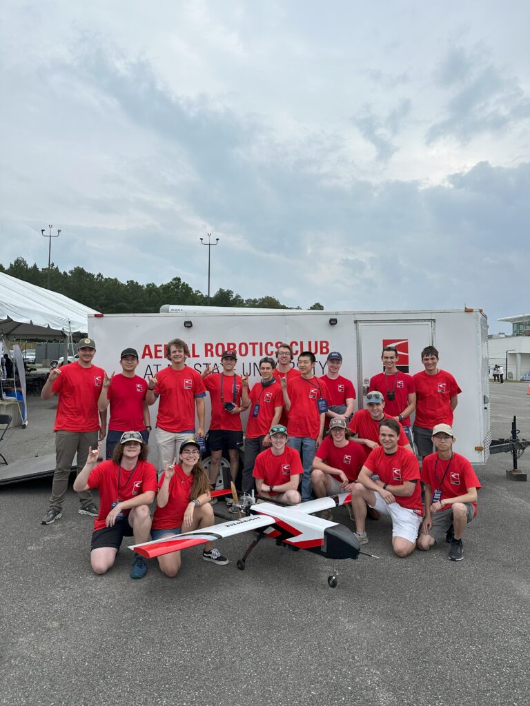 Team members and drone