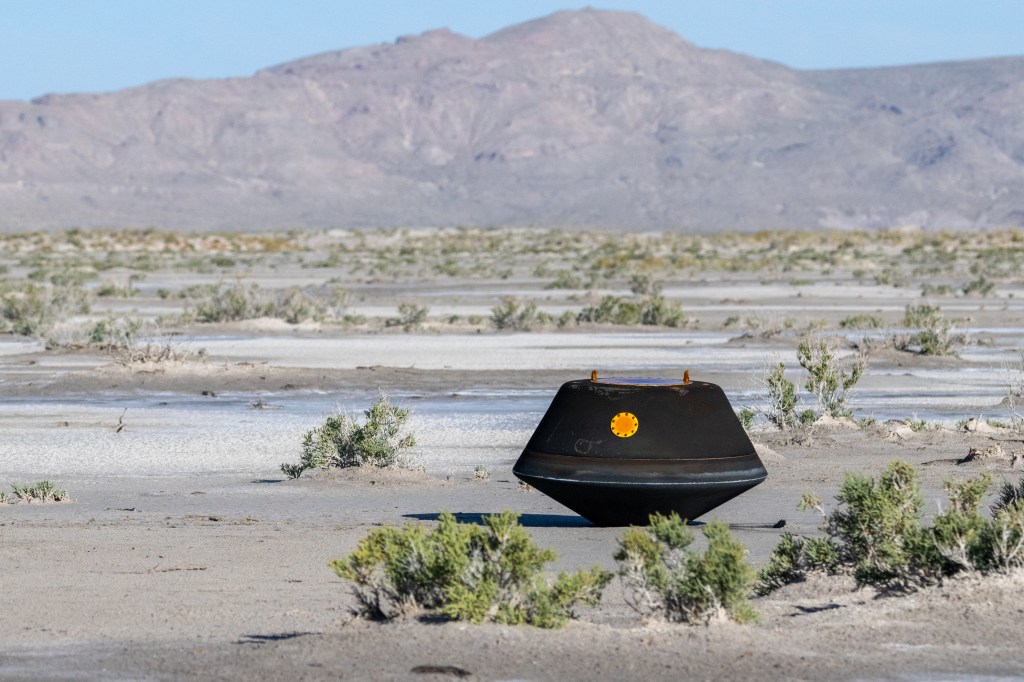 Black object in dessert landscape.