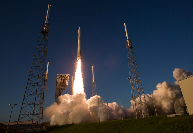 Rocket launching with visible fire and smoke.