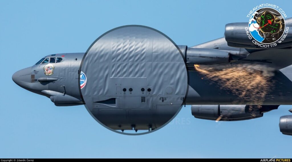 Large cargo airplane in flight with a section enlarged to show surface tension.