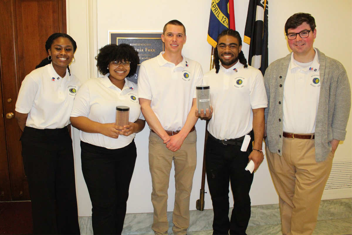 WSSU Astrobotany Lab student researchers and advisor Rafael Loureiro visiting the office of Rep. Virginia Foxx showing off their lunar and martian regolith samples.